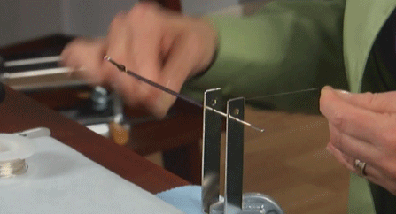 Turning crank to form coil